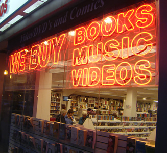 We buy Books, music and video storefront neon sign